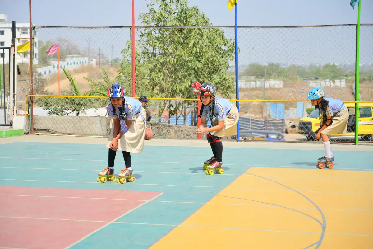 Students participating in sports ground activities at AHPS Pune
